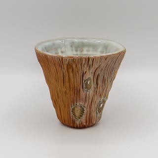 a single Woodfired Wine Cup in earth tones with light blue white interiors.  The cups are staged against a white background.