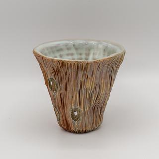 a single Woodfired Wine Cup in earth tones with light blue white interiors.  The cups are staged against a white background.