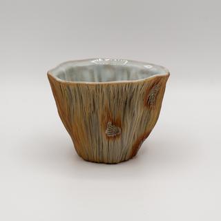 a single Woodfired Wine Cup in earth tones with light blue white interiors.  The cups are staged against a white background.