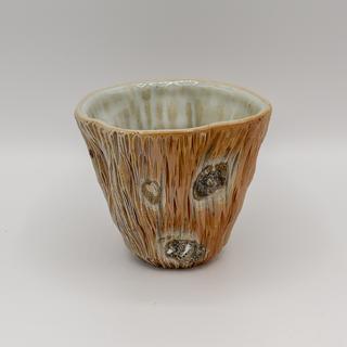 a single Woodfired Wine Cup in earth tones with light blue white interiors.  The cups are staged against a white background.